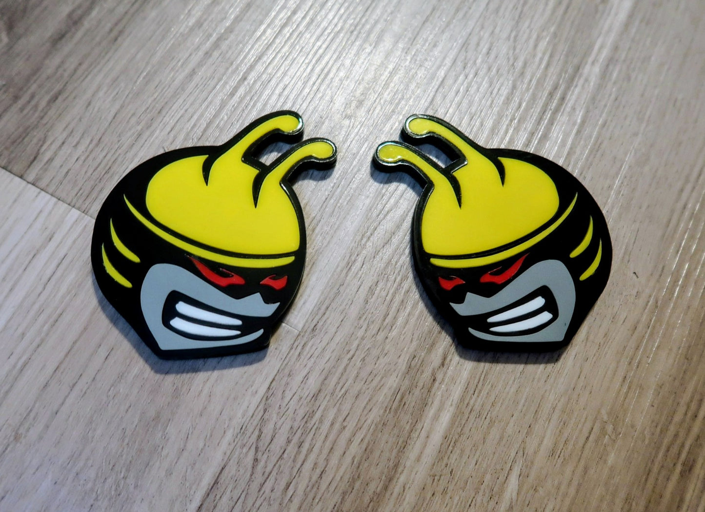 Bee head car badges, 5 color customize-able. 2 included.
