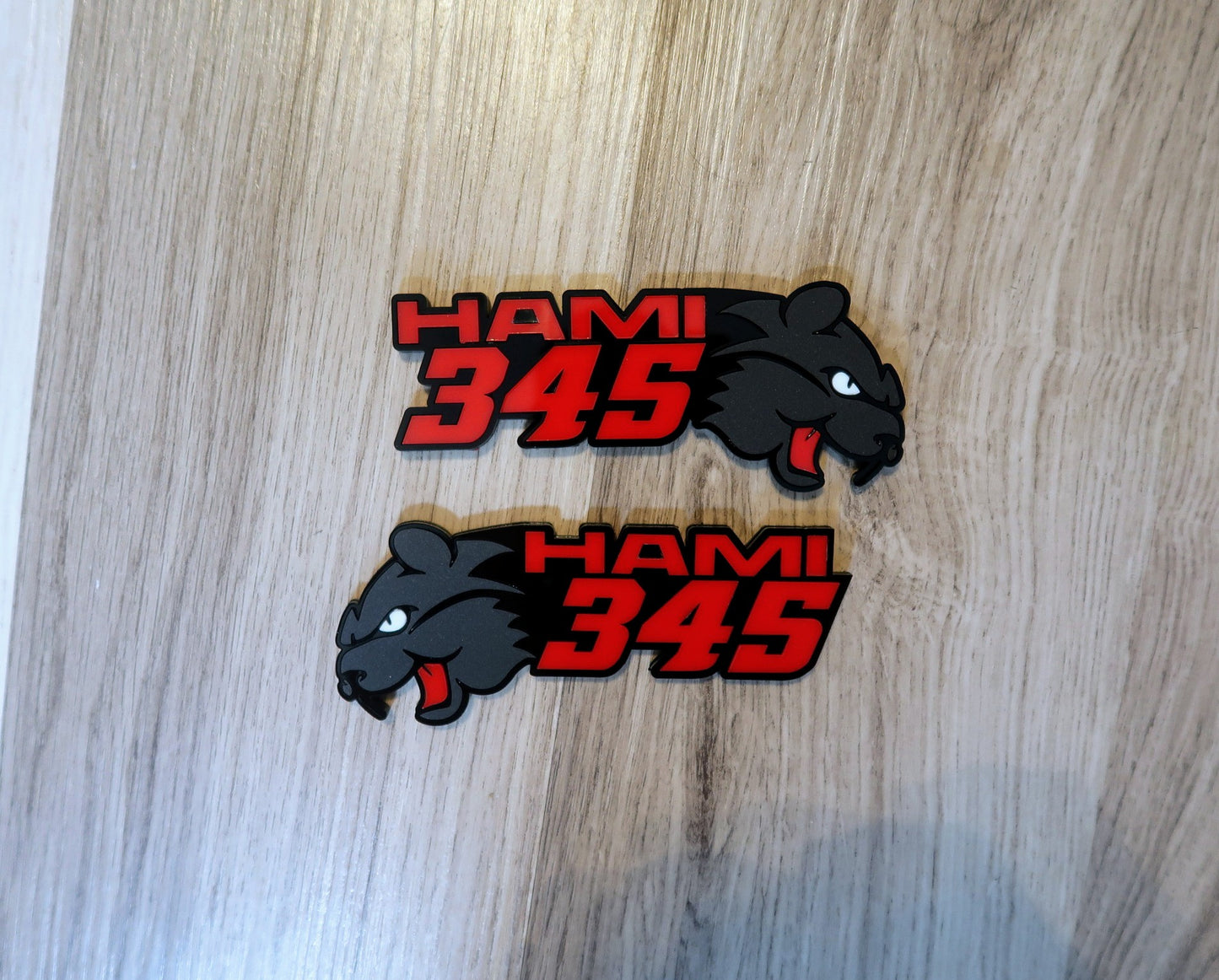 Hami 345, 392, or 396 fender badges. Includes 2.