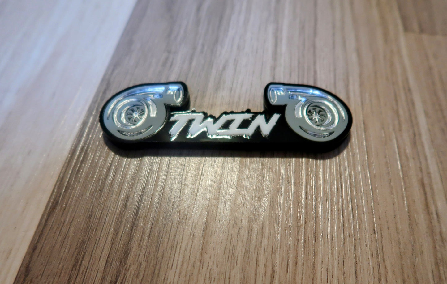 Twin Turbo badge. Includes 1.