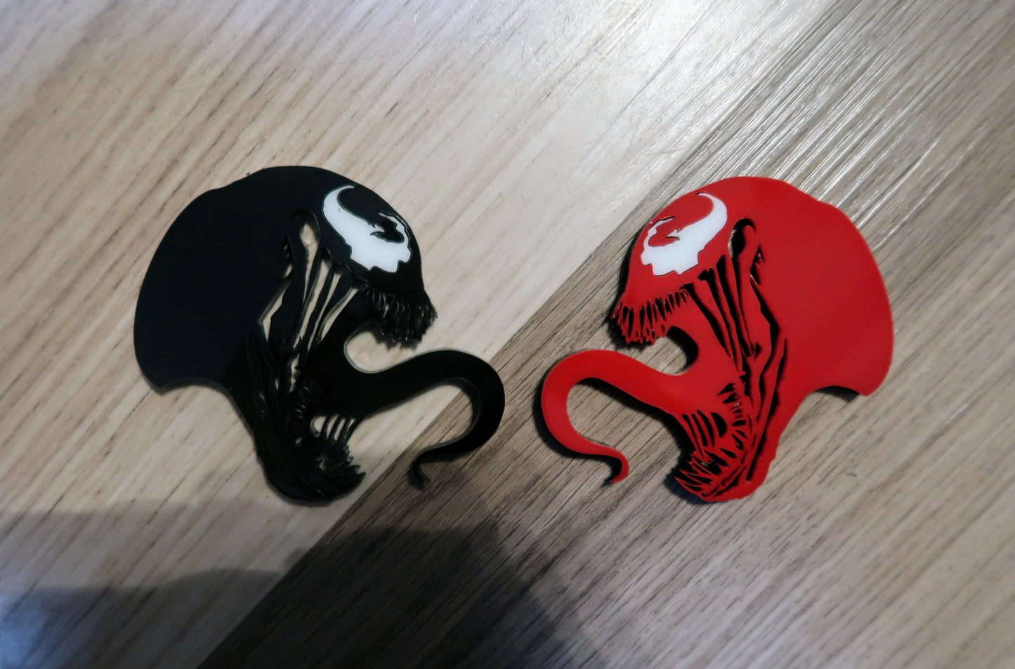 Inspired Carnage and Venom badges. Includes 2.