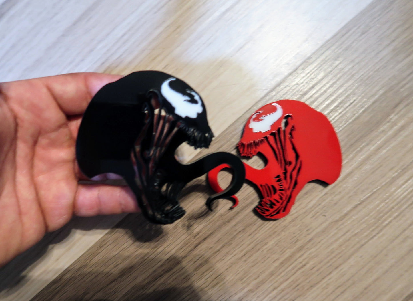 Inspired Carnage and Venom badges. Includes 2.