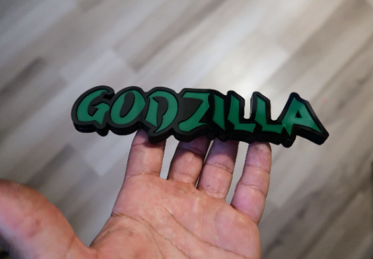 Godzilla car badge