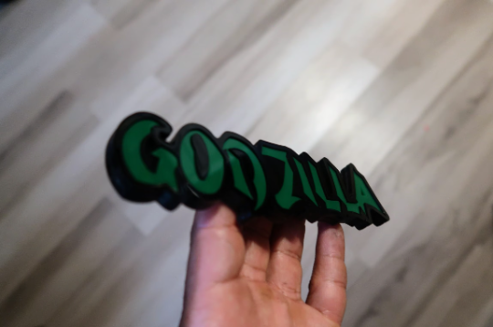 Godzilla car badge