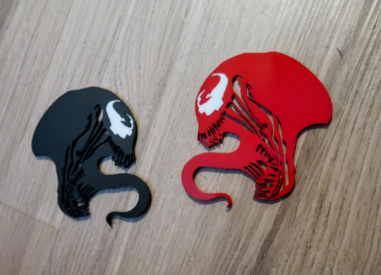 Inspired Carnage and Venom badges. Includes 2.