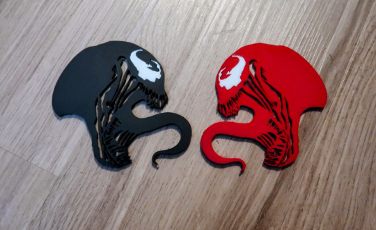 Inspired Carnage and Venom badges. Includes 2.