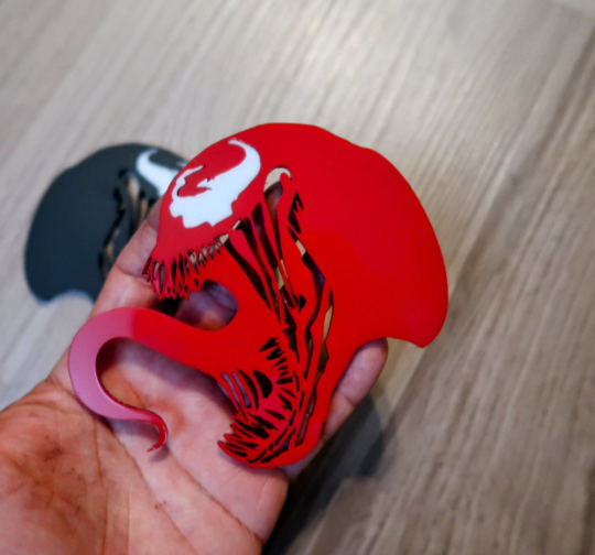 Inspired Carnage and Venom badges. Includes 2.
