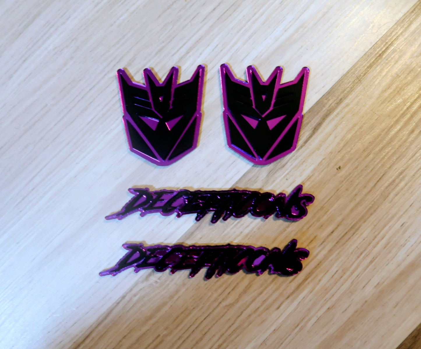 Decepticons text badge. Includes 1.