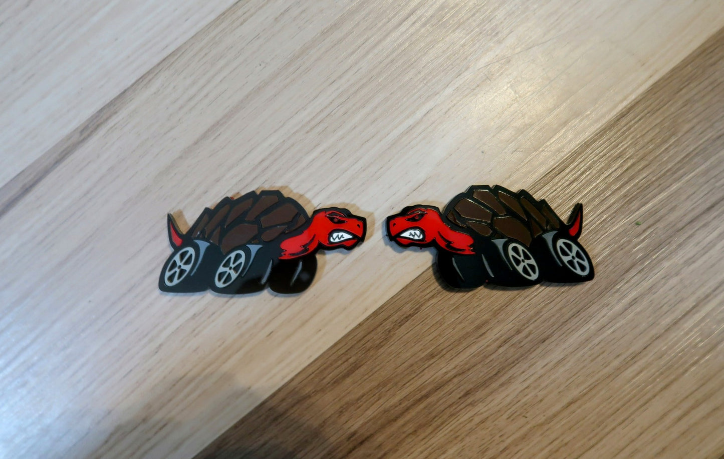 Racing Tortoise badges. Includes 2.