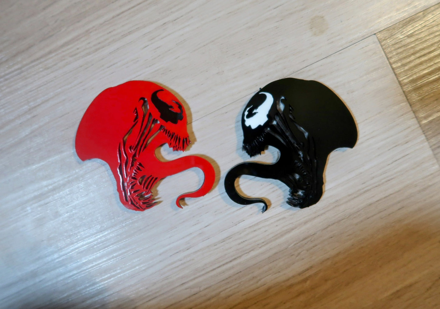 Inspired Carnage and Venom badges. Includes 2.