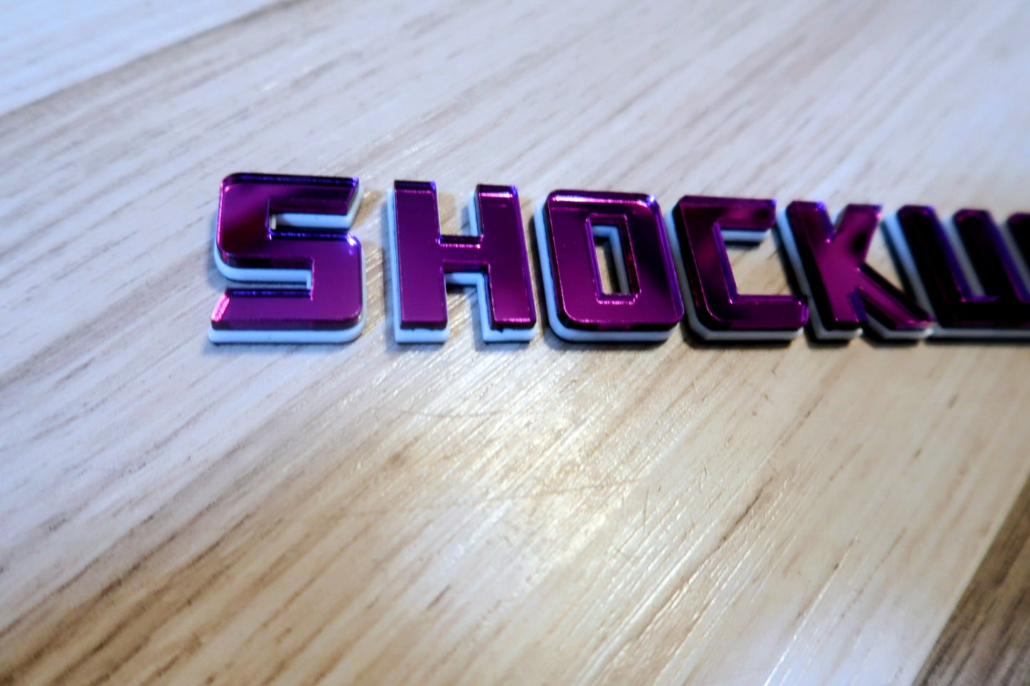 Shockwave text badge. Individual letters with outline.