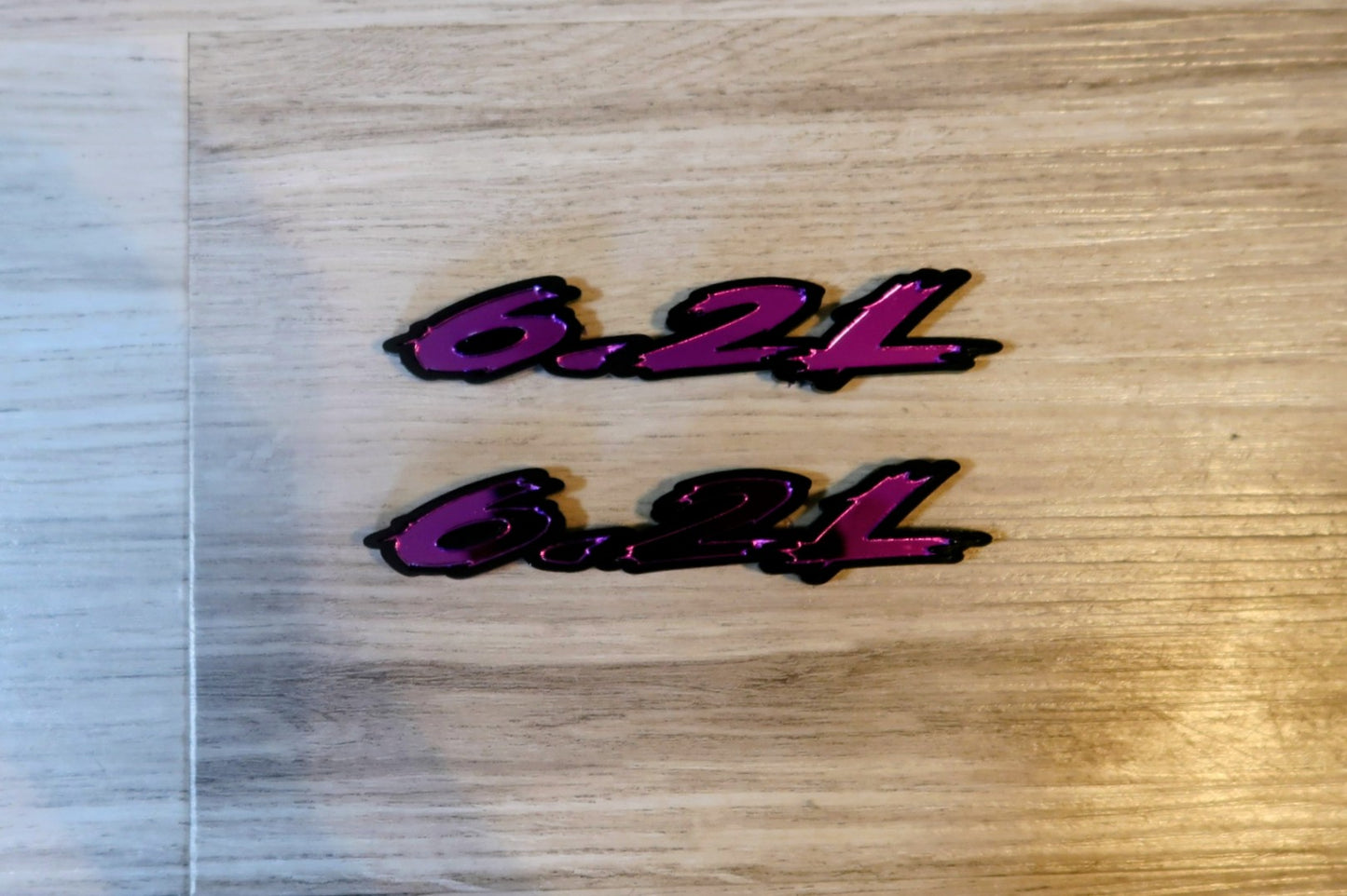 6.2L badges. Includes 2.