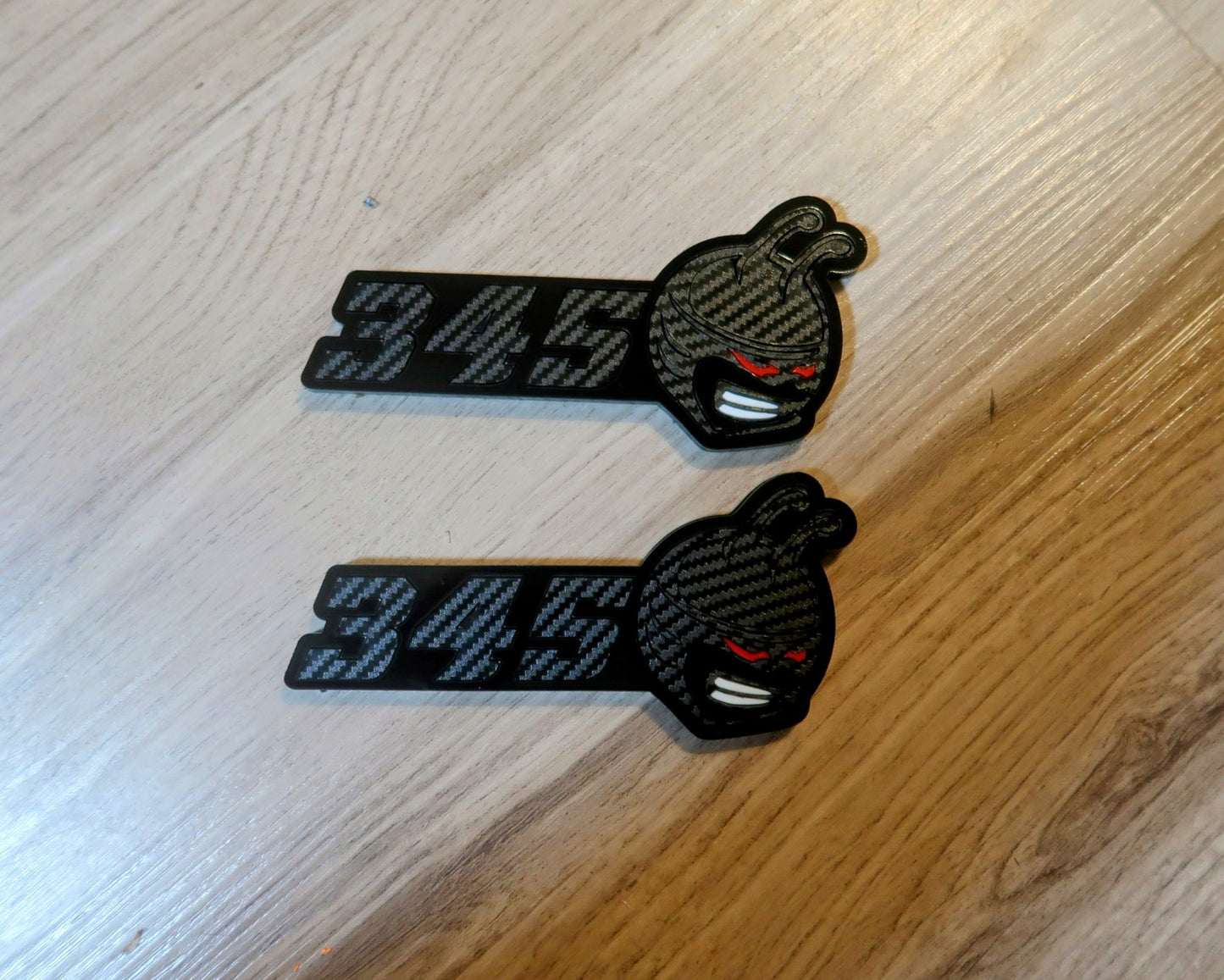 392,345 trunk/wing badge. Includes 2 badges.