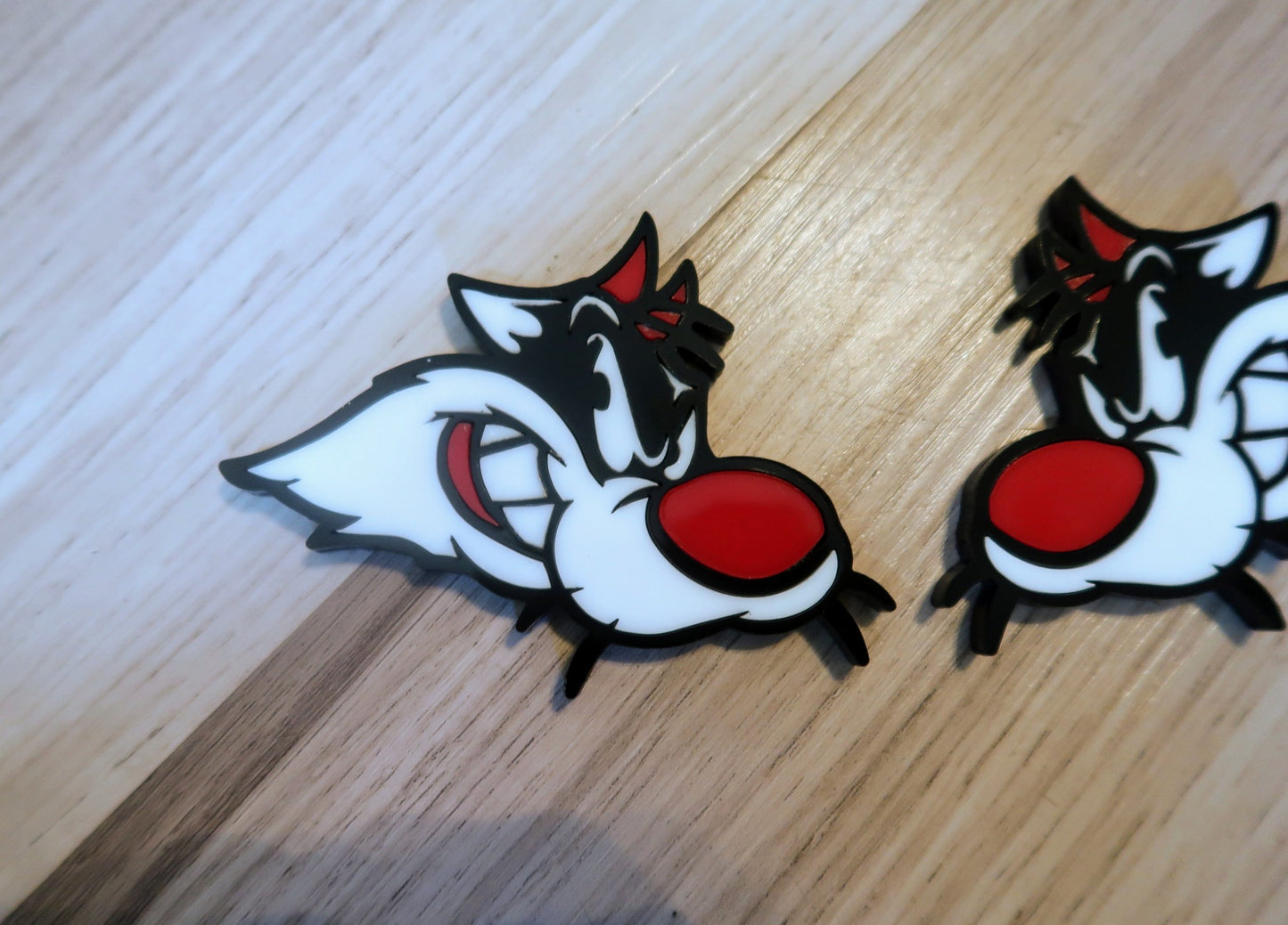 Sylvester Custom badges. Includes 2.