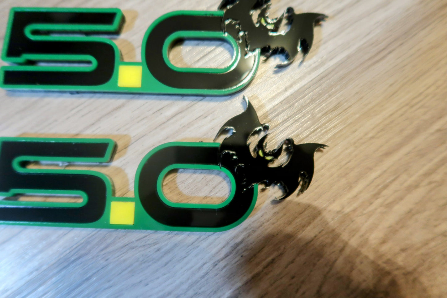 5.0 Bat badges. Includes 2.