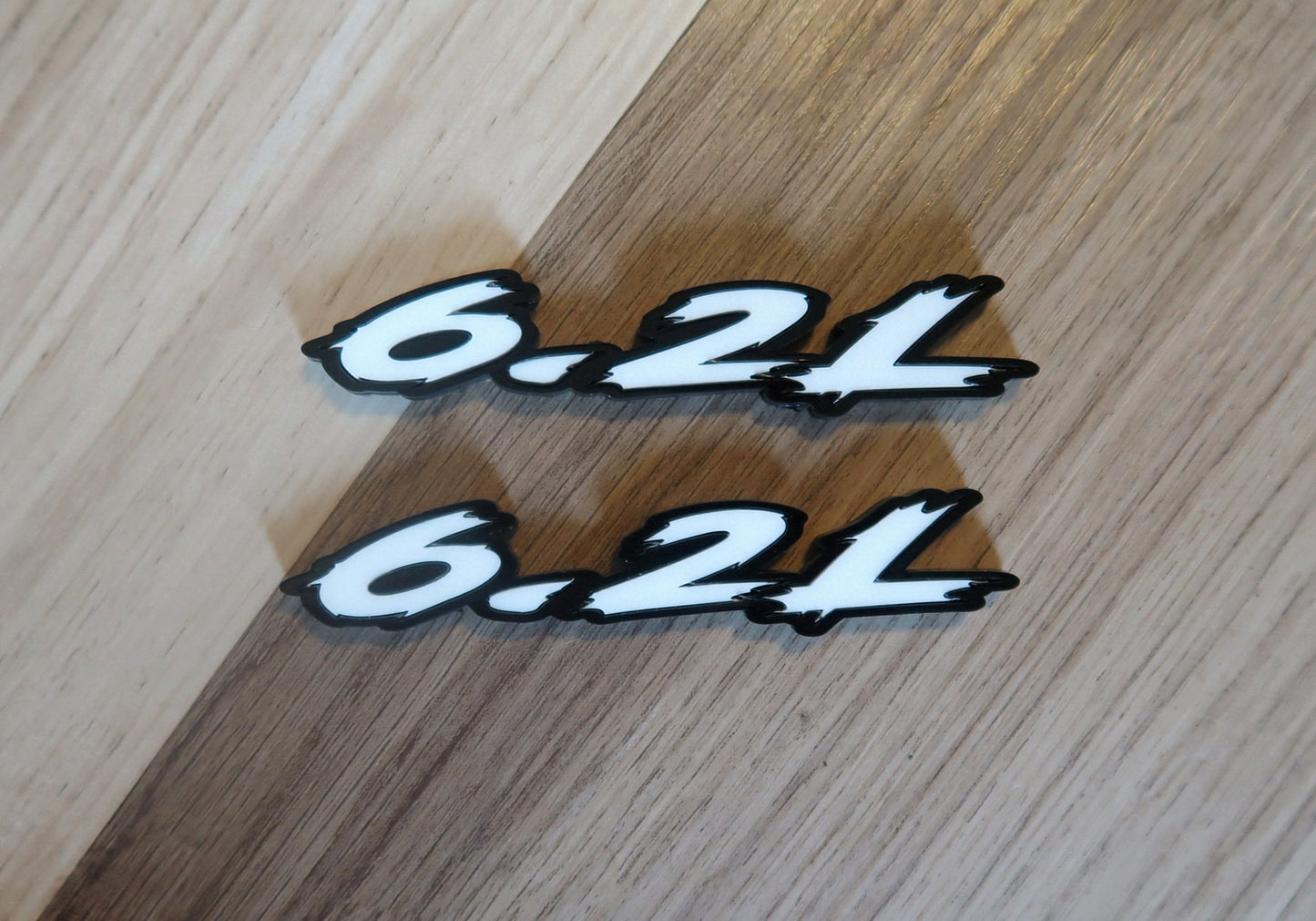 6.2L badges. Includes 2.