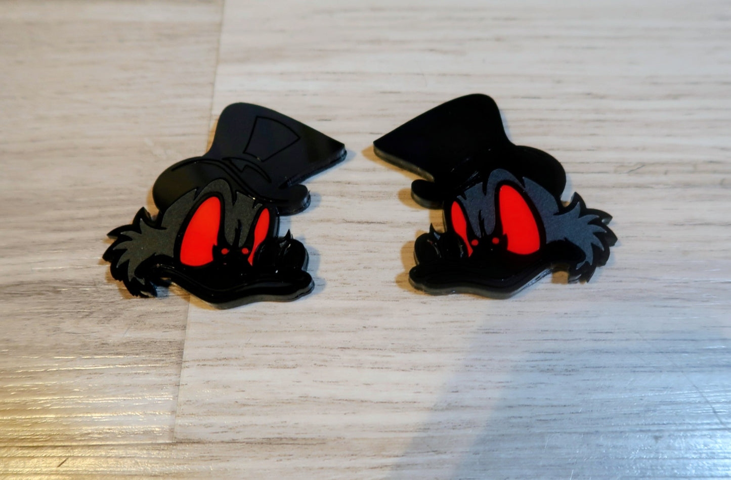 Evil Scrooge fender badges. Includes 2