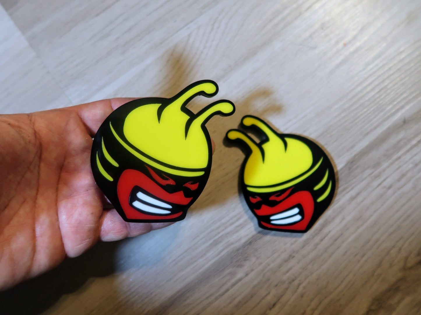 Bee head car badges, 5 color customize-able. 2 included.