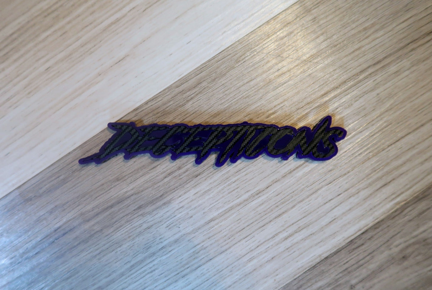 Decepticons text badge. Includes 1.