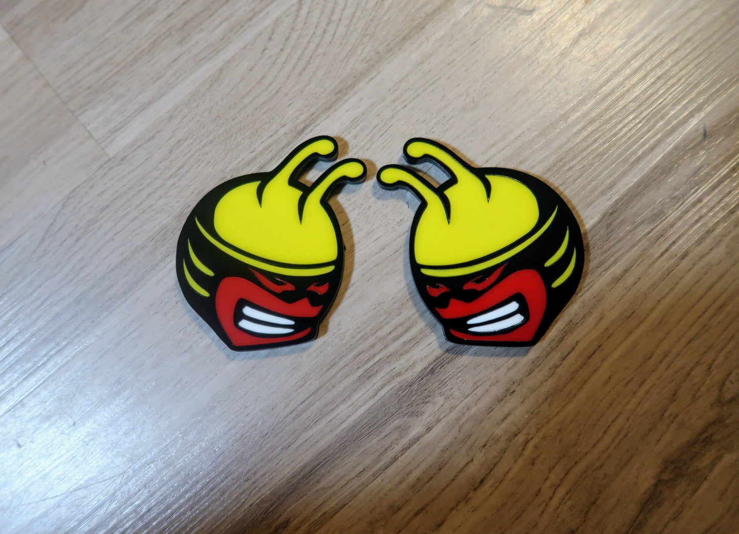 Bee head car badges, 5 color customize-able. 2 included.