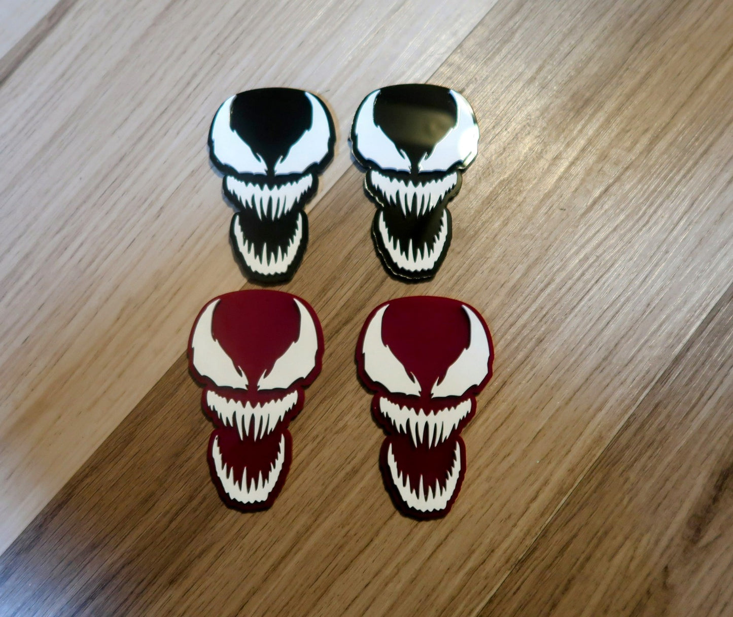 Inspired Carnage and Venom car badges. Includes 2.