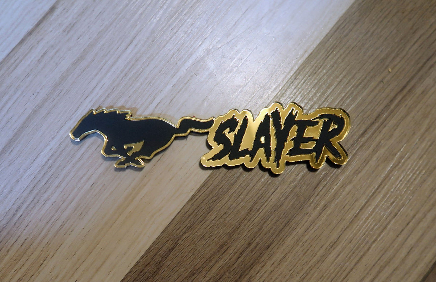 Mustang slayer badge