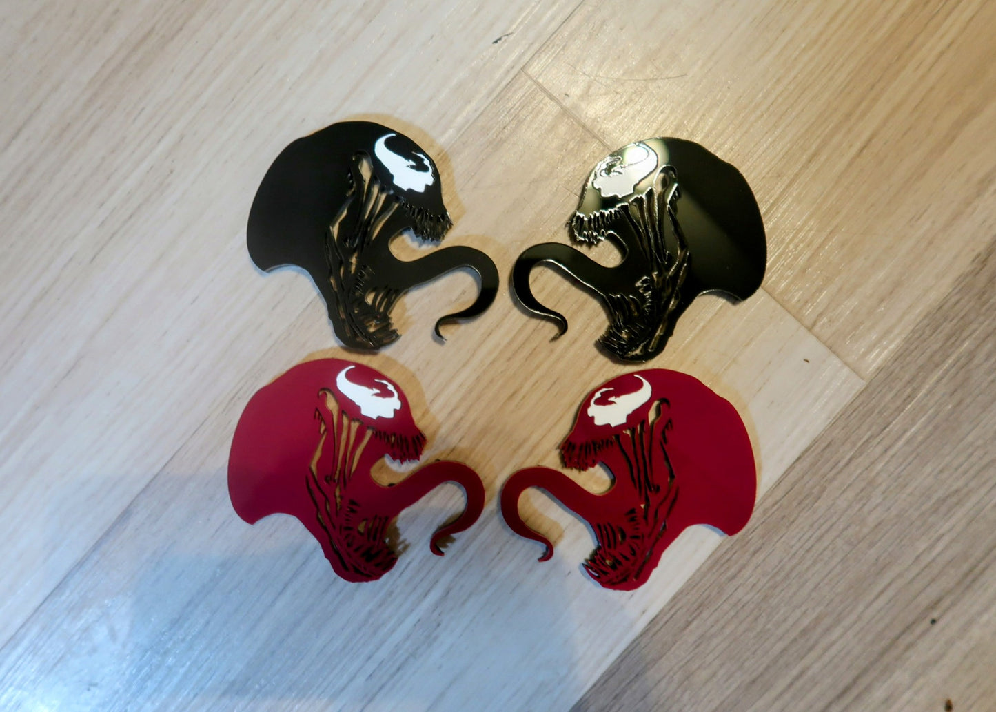 Inspired Carnage and Venom badges. Includes 2.