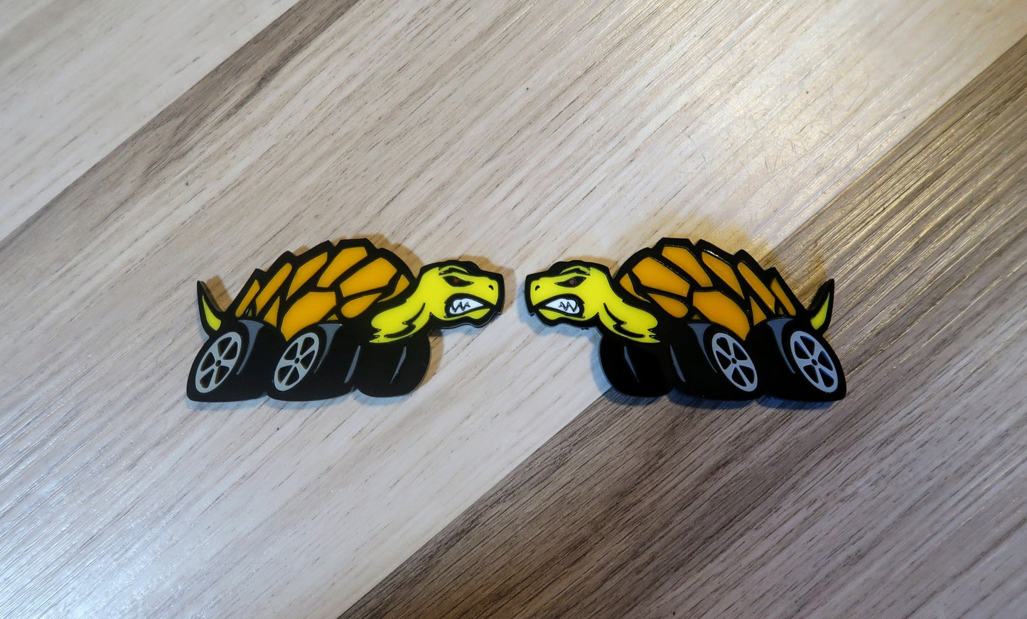 Racing Tortoise badges. Includes 2.