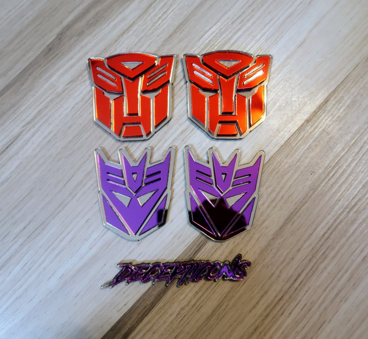 Decepticons text badge. Includes 1.