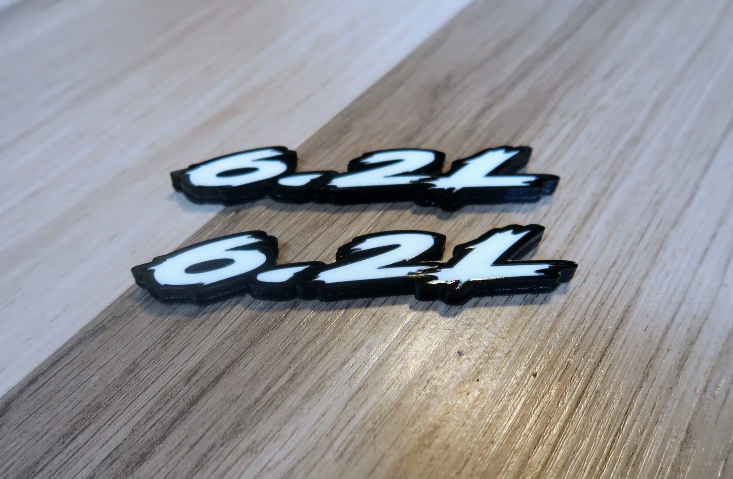 6.2L badges. Includes 2.
