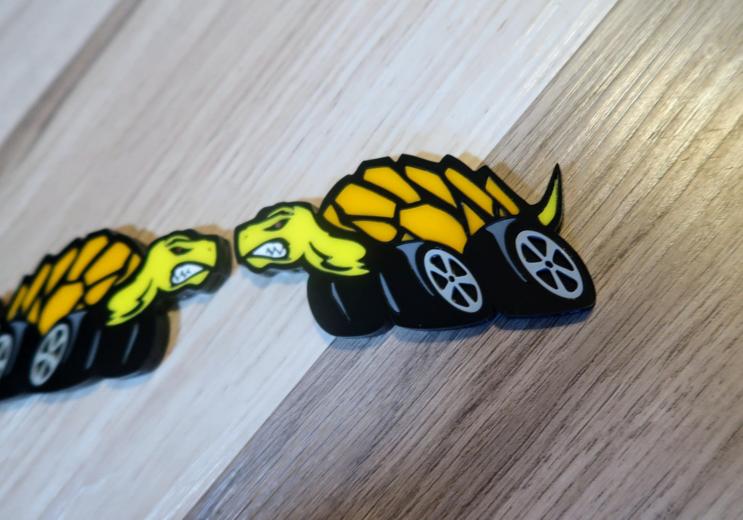 Racing Tortoise badges. Includes 2.