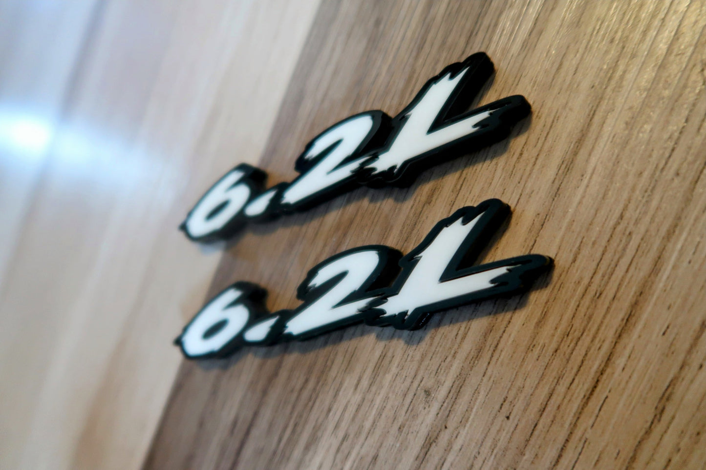 6.2L badges. Includes 2.
