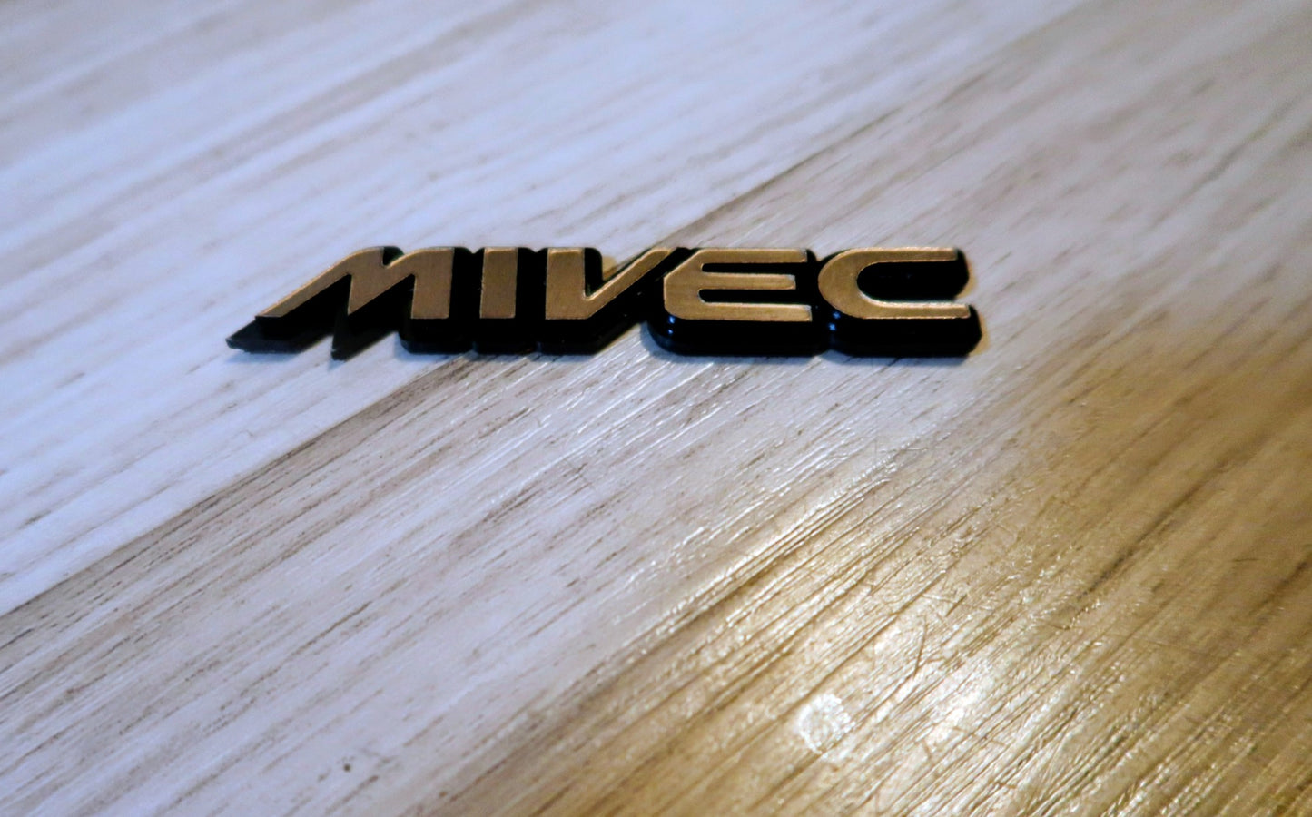 Mivec badge. Includes 1