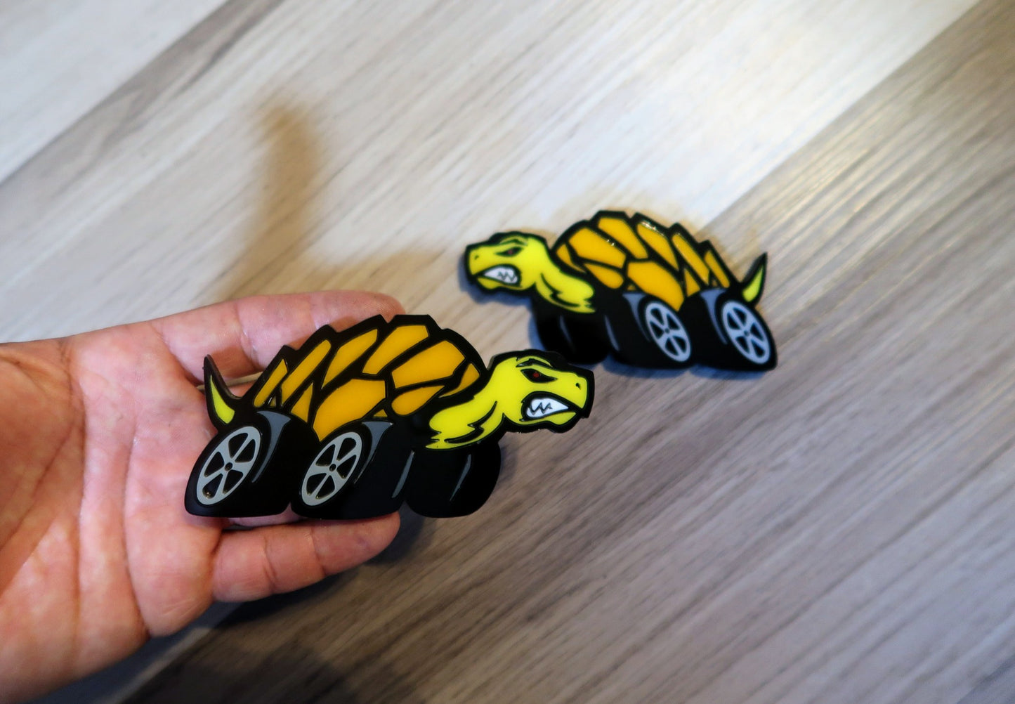 Racing Tortoise badges. Includes 2.