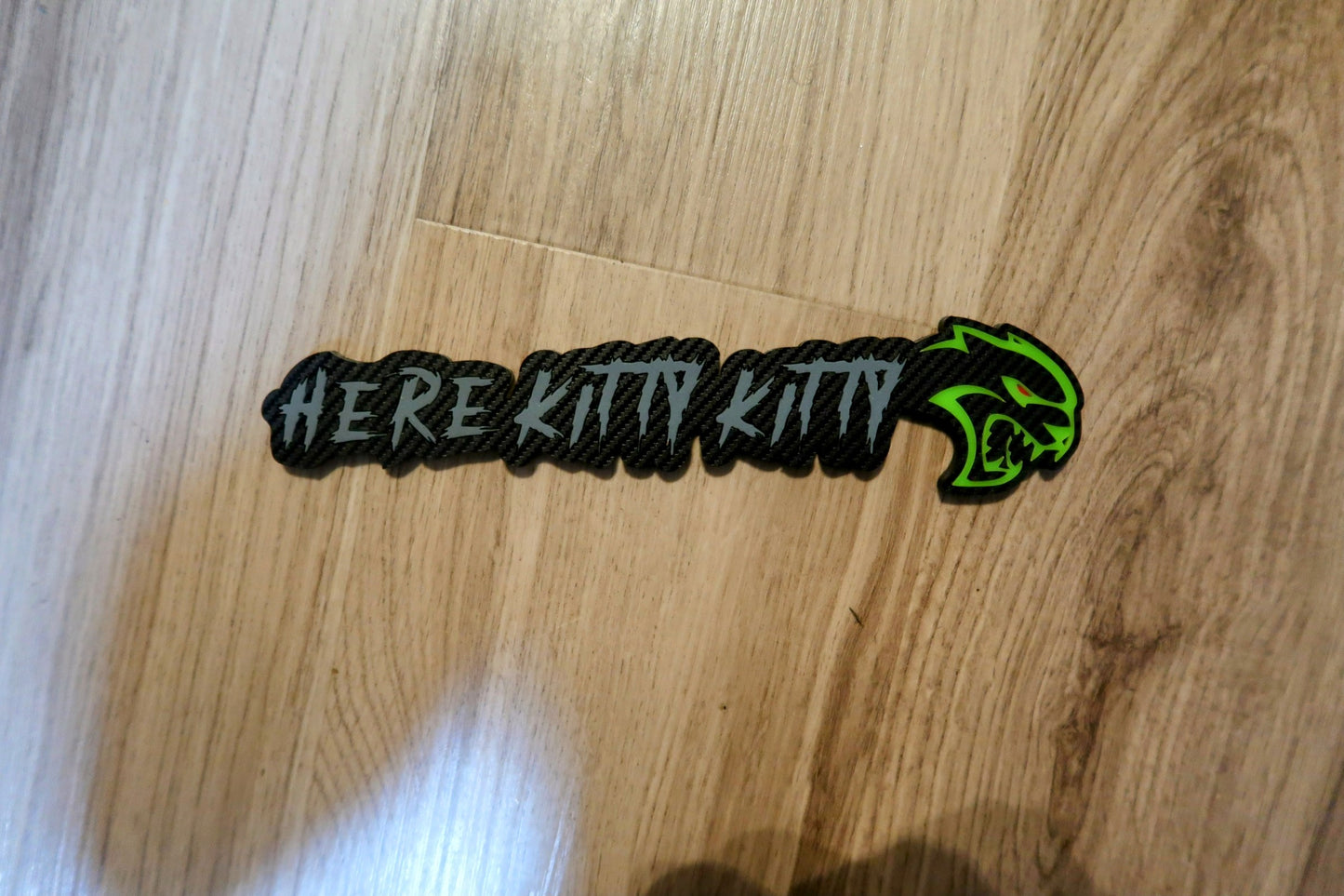 Here Kitty Kitty car badge