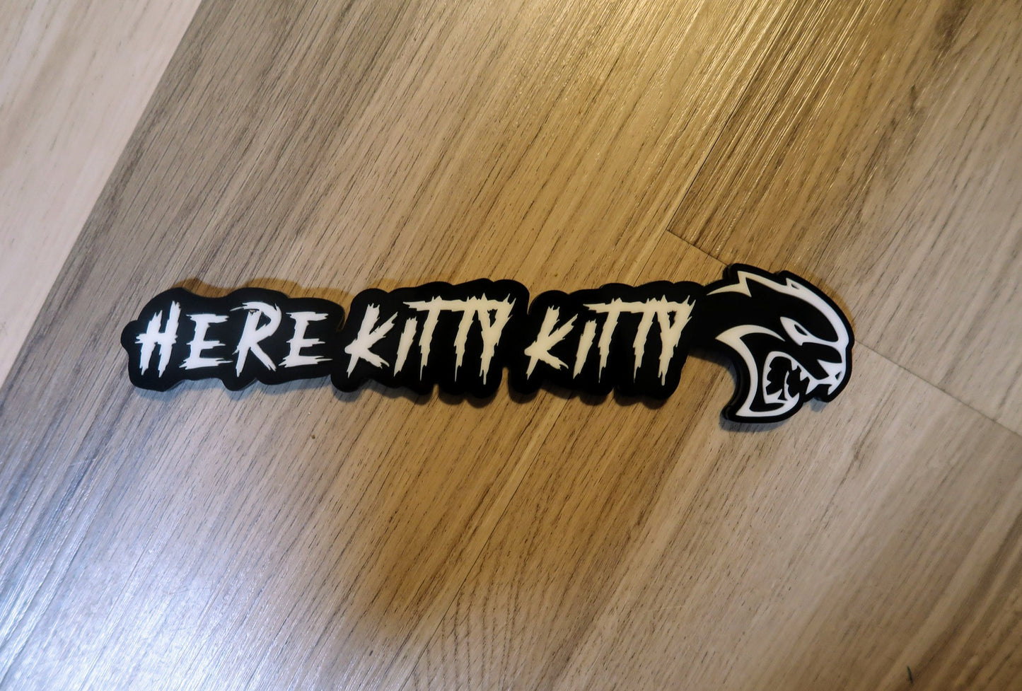 Here Kitty Kitty car badge