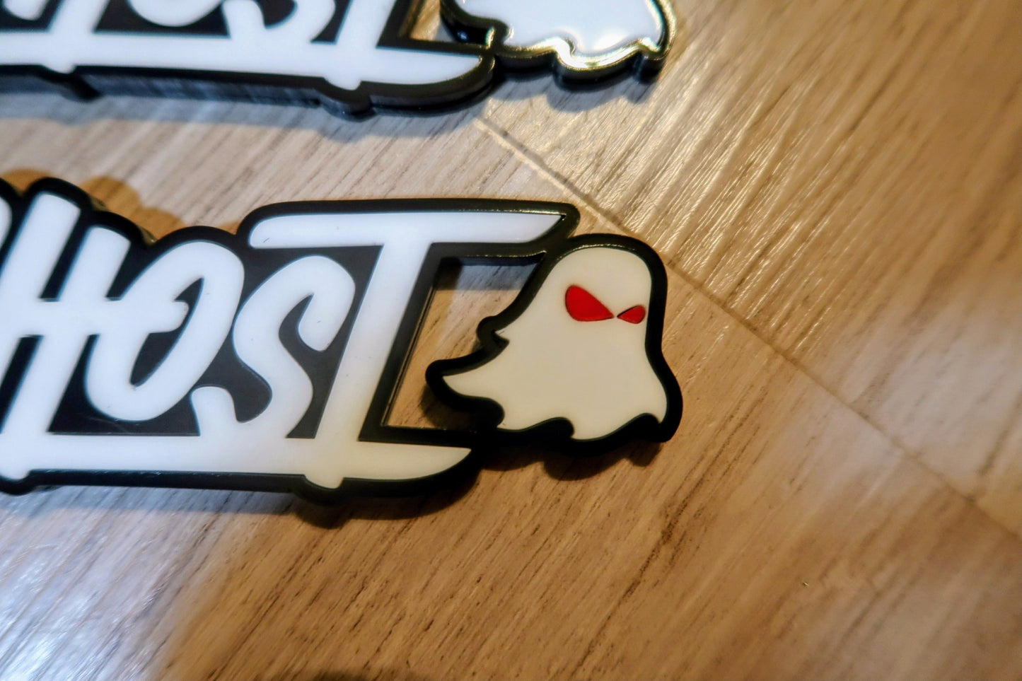 Ghost trunk and grill badge. Includes both.