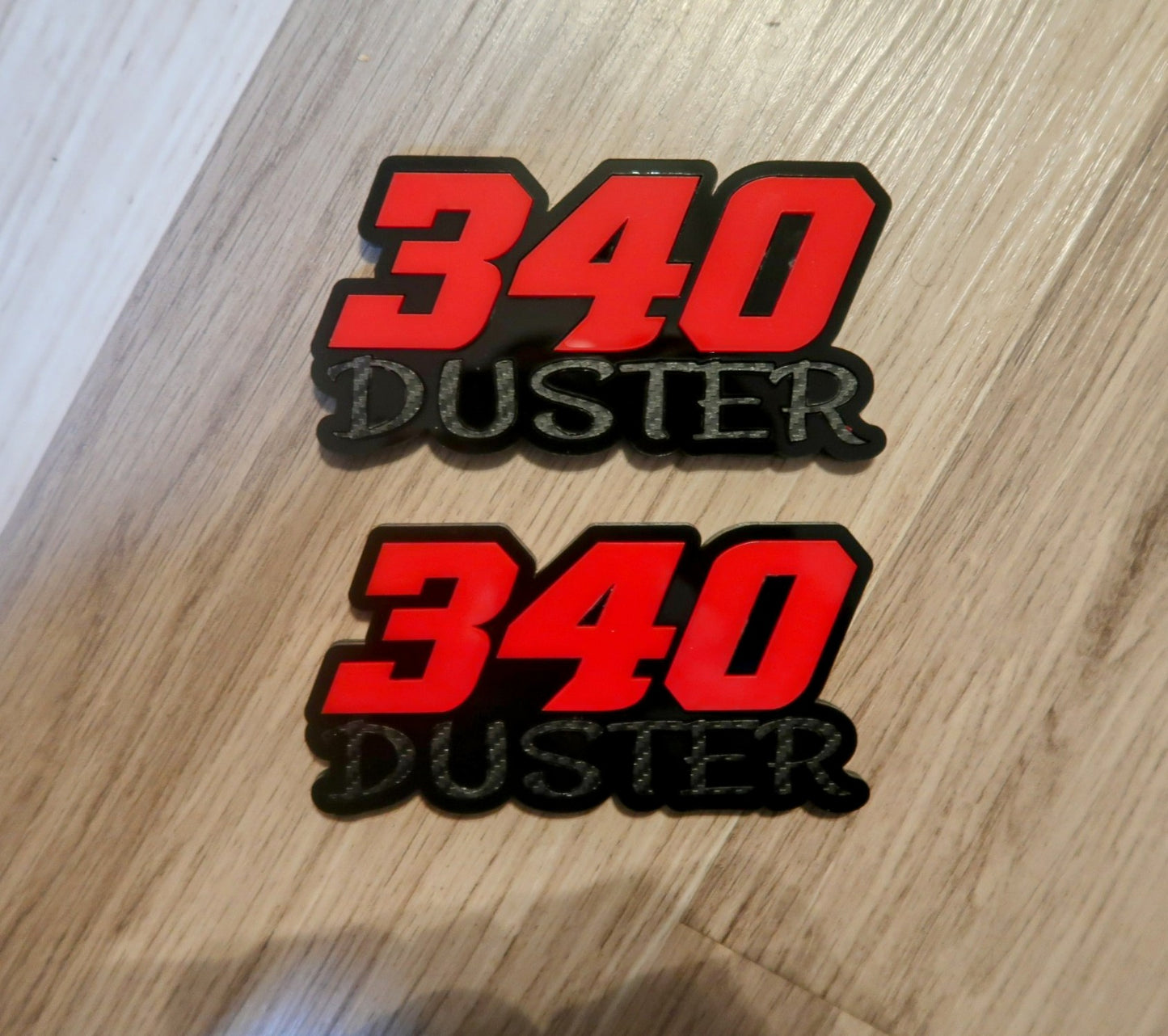 340 Duster fender badges. Includes 2.