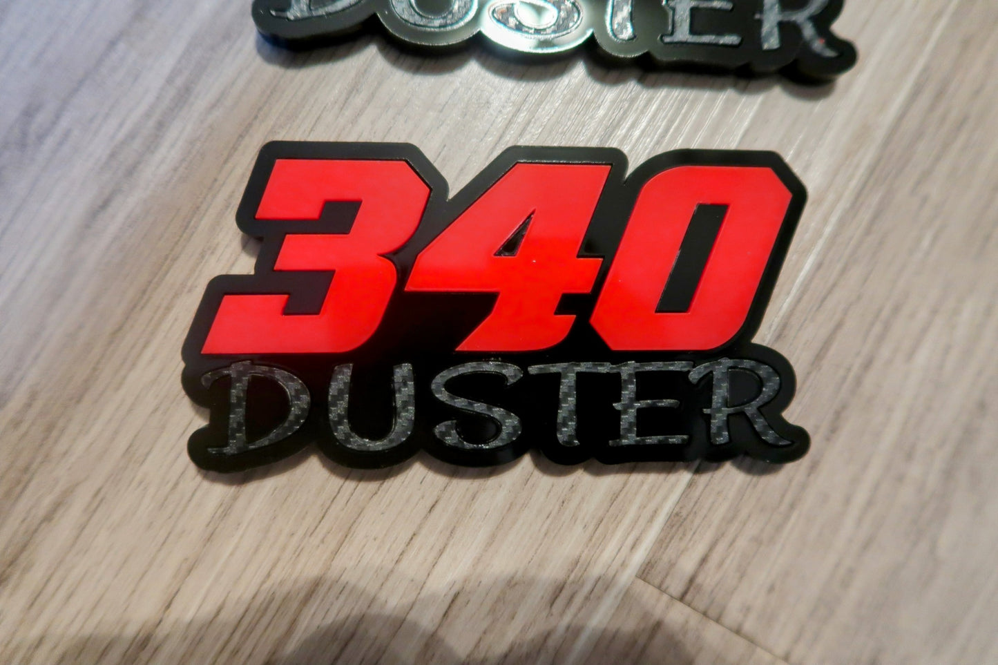 340 Duster fender badges. Includes 2.