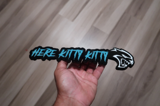 Here Kitty Kitty car badge