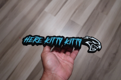 Here Kitty Kitty car badge