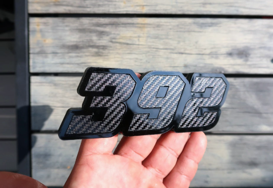 392, or 345, or 426 fender badges. Includes 2.