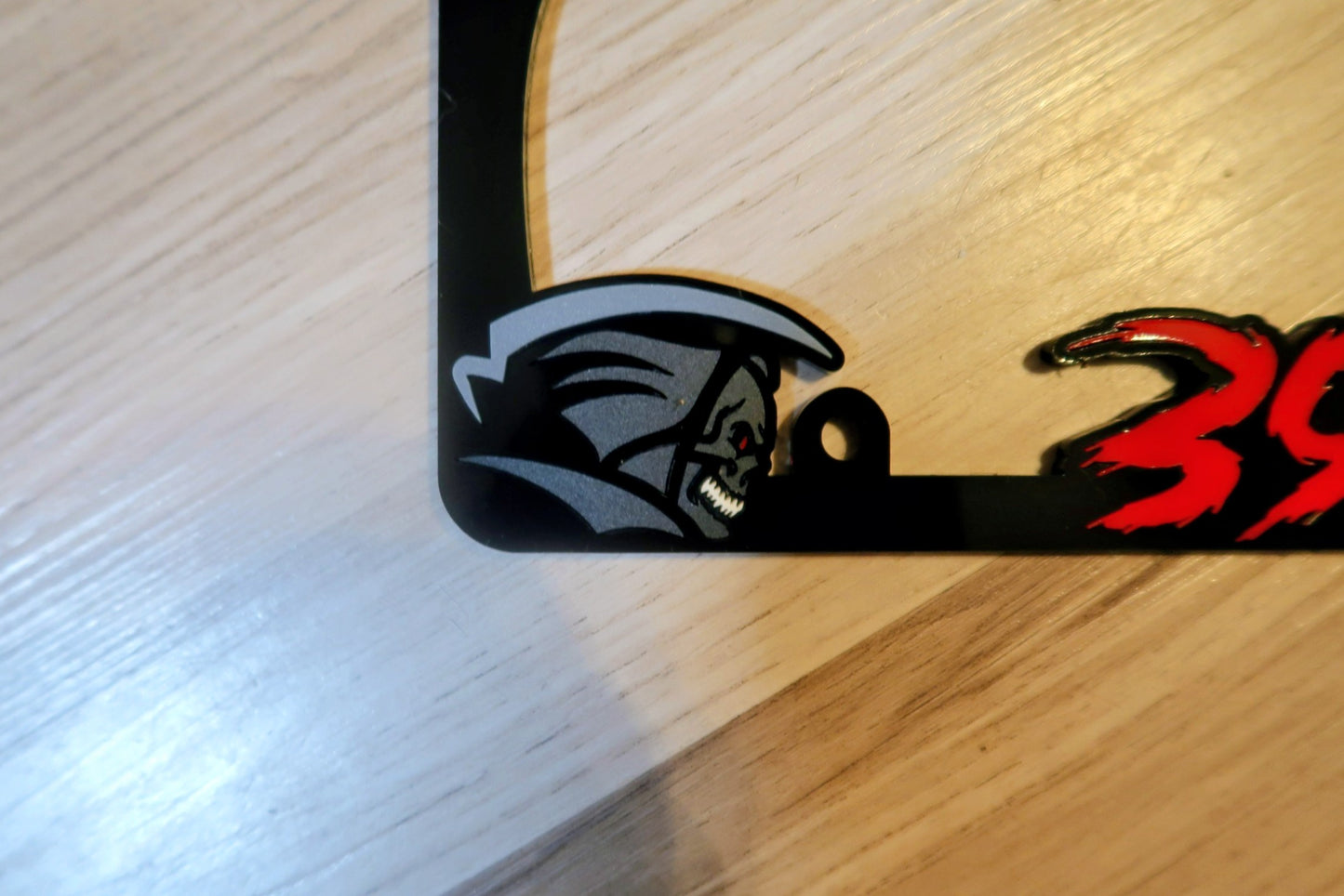 Grim Reaper custom license plate frame.