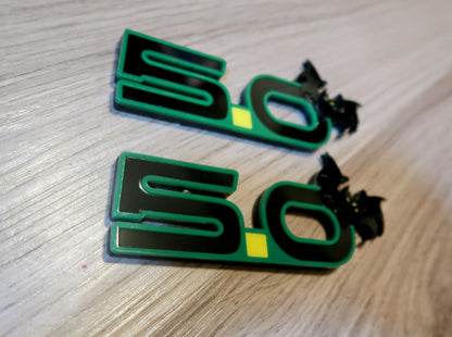 5.0 Bat badges. Includes 2.
