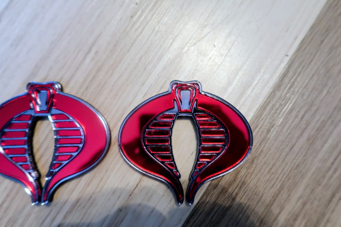 G.I. Joe Cobra badges. Includes 2