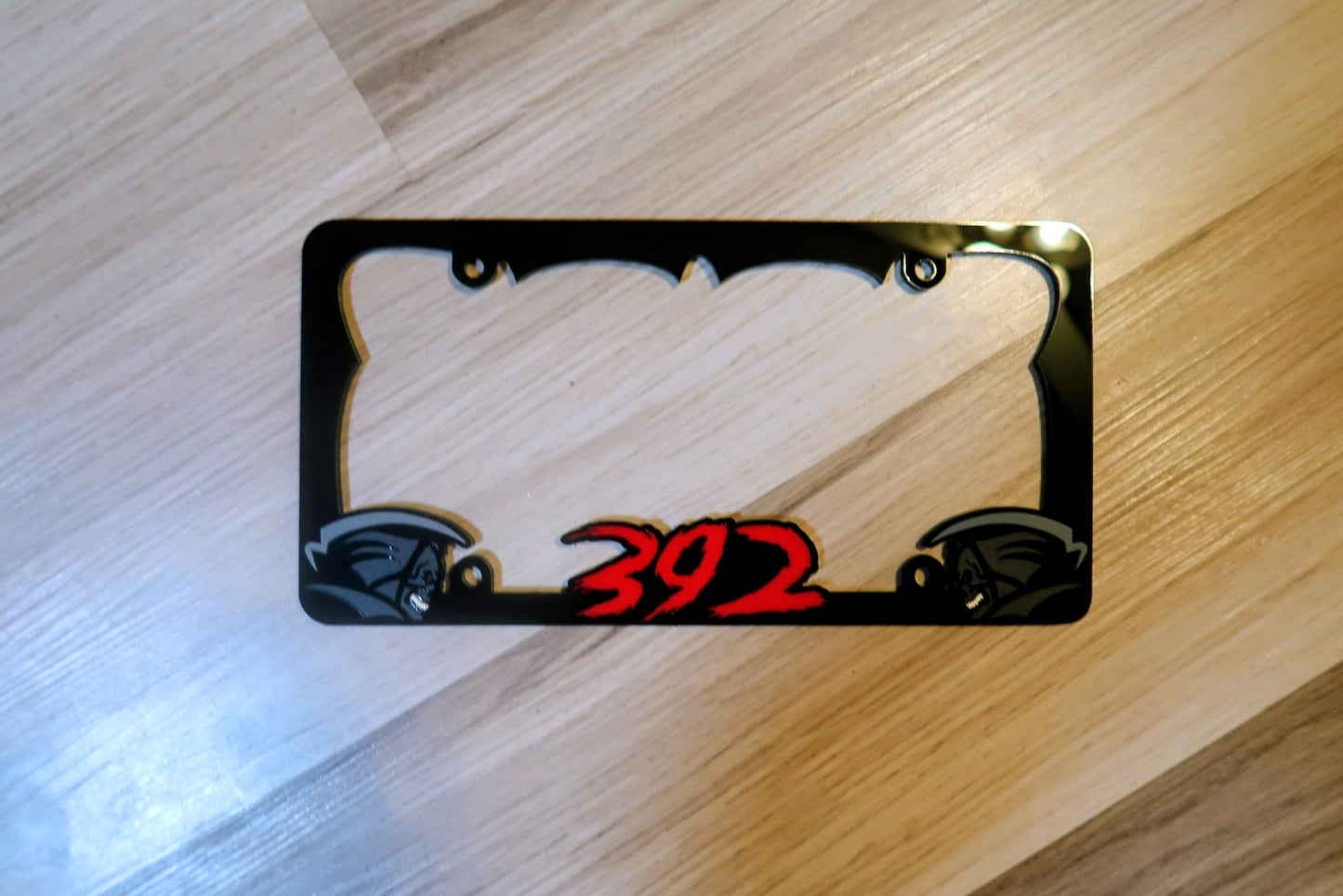 Grim Reaper custom license plate frame.