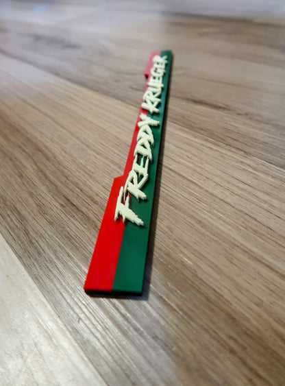 Custom Freddy Krueger badge.
