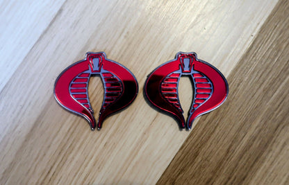 G.I. Joe Cobra badges. Includes 2