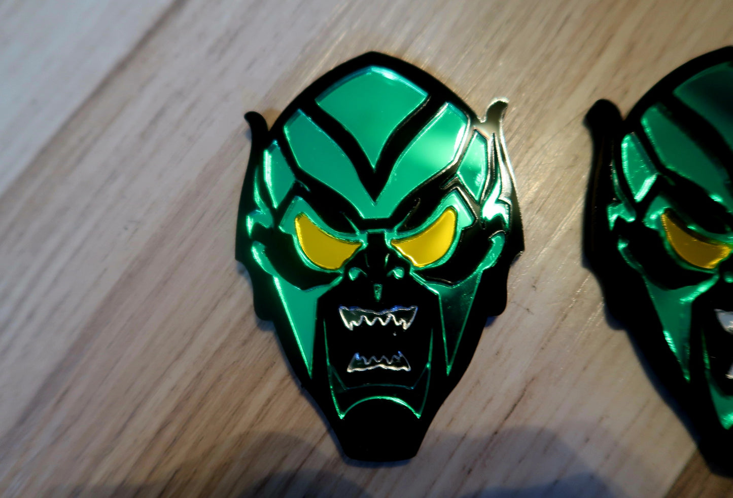 Inspired Green Goblin badges. Includes 2.