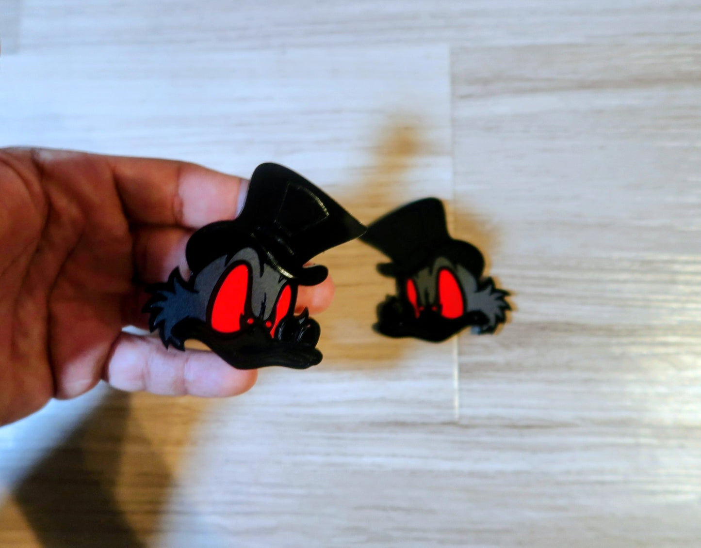 Evil Scrooge fender badges. Includes 2