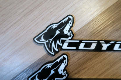 Coyote badges. Includes 2.